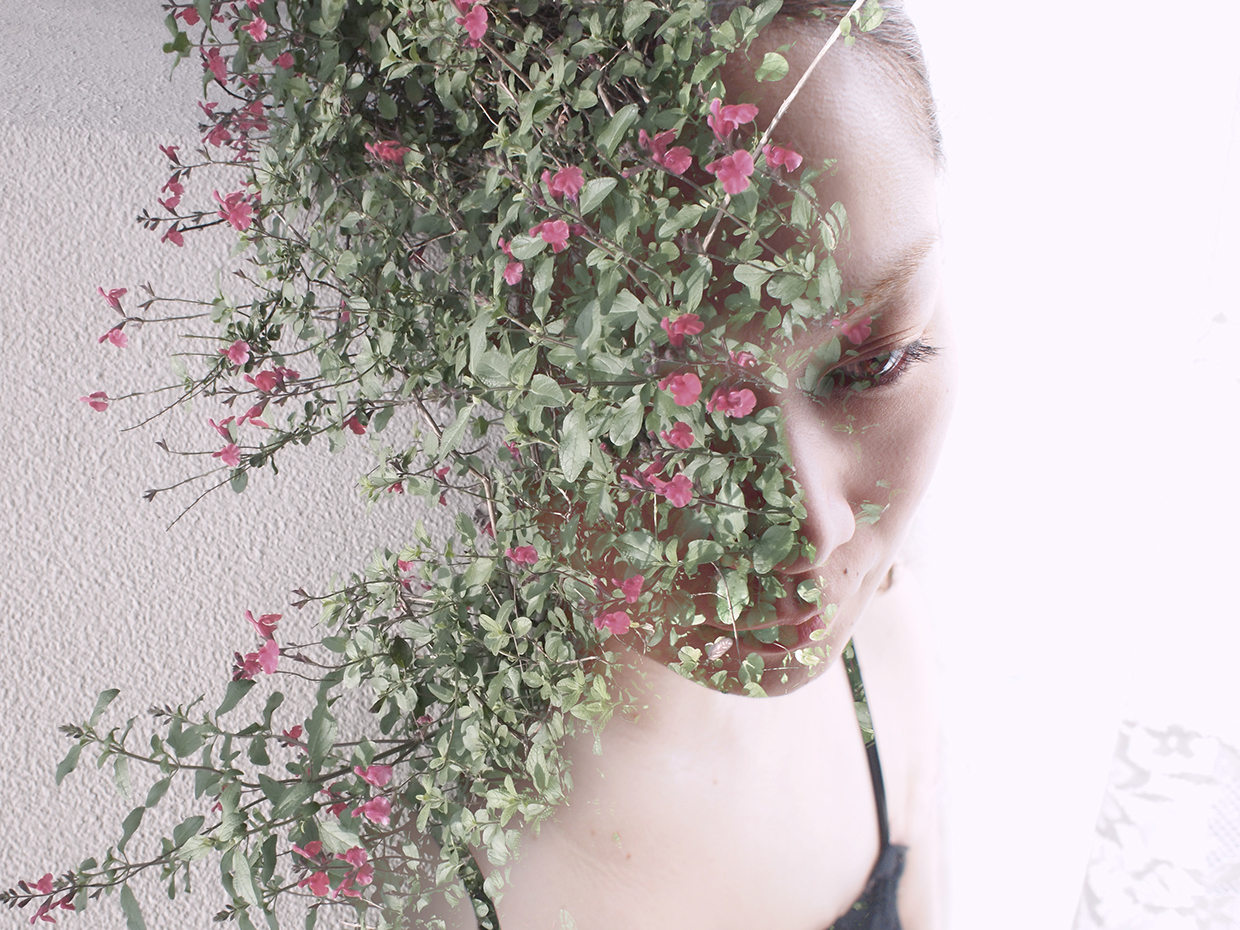 A double-exposure photograph by Miki Takahashi combining a female face with elements of nature and cityscapes.
