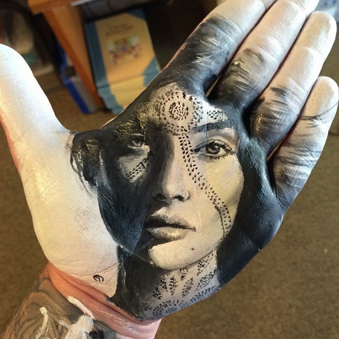 Russell Powell takes social media by storm creating portraits on the palms of his hand