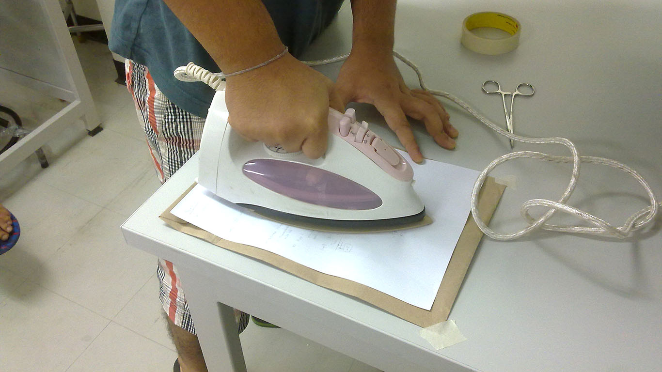 The ink from the paper will be transferred to the copper plate due to the heat