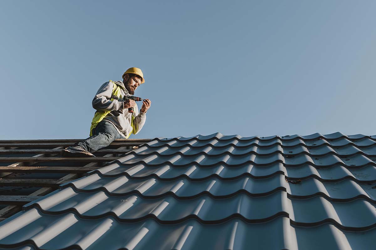 Professionals repair roof leak