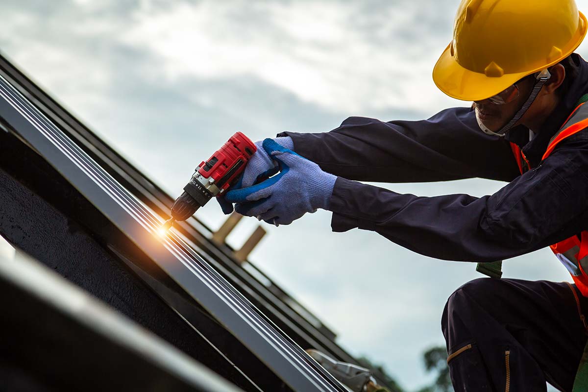 Professionals repair roof leak